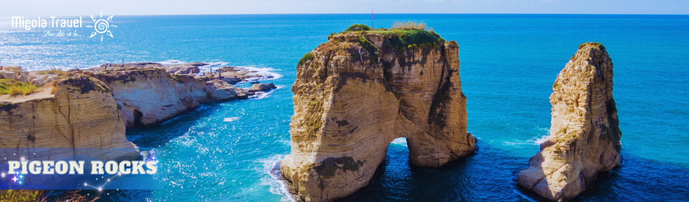 Pigeon Rock (Raouché Rock) là cụm đá tự nhiên nổi tiếng nằm sát bờ biển Corniche ở Beirut, được xem như biểu tượng của thành phố. Hai khối đá khổng lồ trồi lên giữa biển, đặc biệt đẹp vào lúc hoàng hôn khi sóng biển và ánh nắng vàng tạo nên khung cảnh rất ấn tượng.